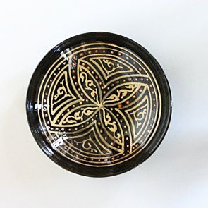 Flat bowl with dark brown glaze and light brown stylized ornamental decoration
