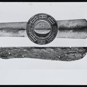 Two Chinese Neolithic jade knives for ritual harvest in black and white photo