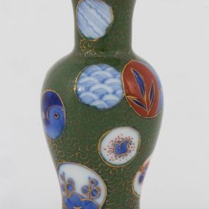 Small vase decorated with roundels on green base