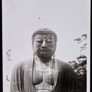 Giant Buddha seems to be watching worshippers at his feet