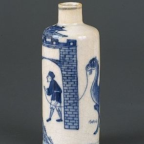 Snuff bottle decorated with the figure of a man leading his camel and its young across a town gate