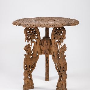 Three-legged, carved table