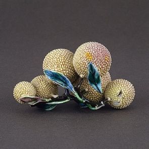 Six litchis on a leafy bough (table decoration)