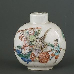 Snuff bottle decorated with the figure of a deity sitting on a wheeled palanquin