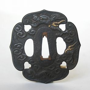 Four-lobed swordguard (tsuba) with dragon in the clouds motif