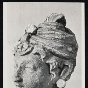 Black and white photo of a man's head, fragment