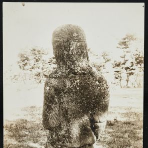 Black and white photo of a stone statue of a nomadic warrior