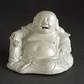 Laughing Budai with a sack and a peach