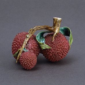 Three fruits on a leafy bough (table decoration)