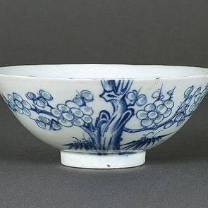 Cup decorated with a blossoming plum tree