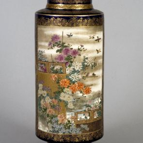 Cylindrical vase decorated with birds and flowers imagery