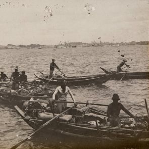 Singapore: Pineapple and banana sellers bellow our ship