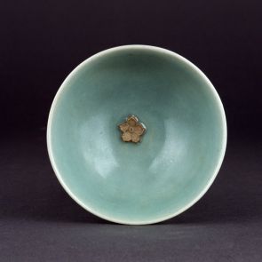 Cup with a plum flower