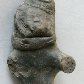 Half figure of male deity, terracotta