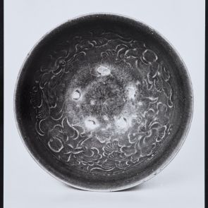 Ceramic bowl with olive green glaze and pressed pattern