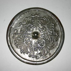 Bronze mirror with four stylized flowers