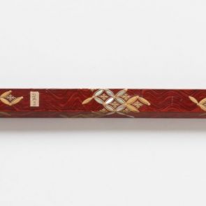 Ornamental hairpin (kōgai) with red and gold lacquer flower motifs