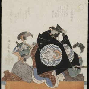 A scene from the bunraku (japanese puppet theatre): Three puppeteers moving a puppet