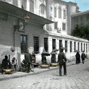 Constantinople. Shoe shiners by Yeni Mosque, and a clock showing the official time