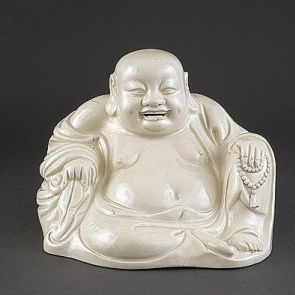 Laughing Budai with a sack and a rosary in his hands