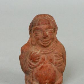 Terracotta statuette of a male figure with belly