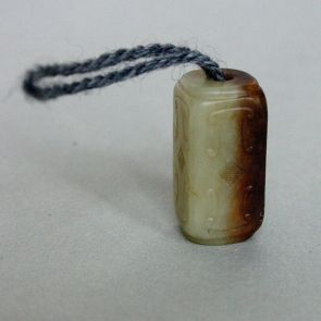 Rectangular bead with incised spiral decoration