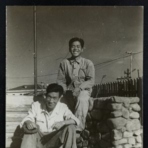 Street photographs: Two Korean men smiling on the stairs