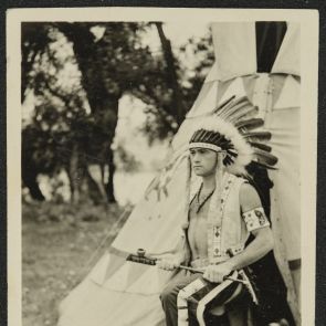 Young Indian with a peace pipe