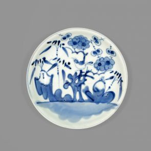 Blue and white plate with small bird