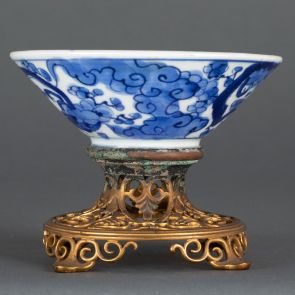 Bowl decorated with dragons and branches in bloom, with additional metal stand