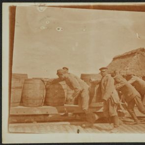 Lajos Schöne's bequest: Photographs from World War I. Soldiers push a wagon loaded with barrels