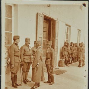 Lajos Schöne's bequest: Photographs from World War I. Two senior officers talk to the lined-up soldiers