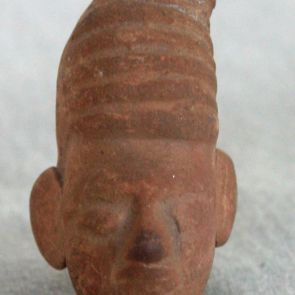 Male head. Terracotta fragment.