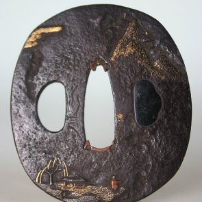 Oval tsuba with three slots, with landscape motif