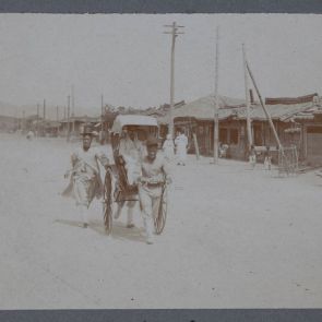 Seoul, rickshaw men in top hats