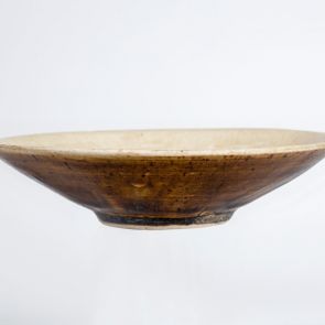 Brown glazed bowl with light glaze inside