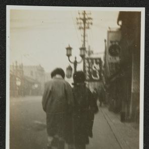 Street scene with a couple walking away, Kyoto, 1936