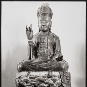 Black and white photo of a bodhisattva sitting on a lotus throne held by a lion