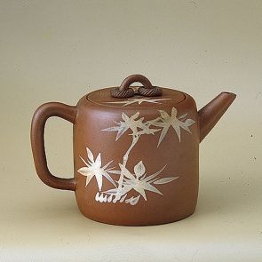 Teapot with a landscapes and bamboo motifs