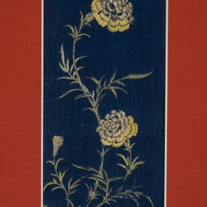 Fragment of women's clothes with  chrysanthemum  motifs