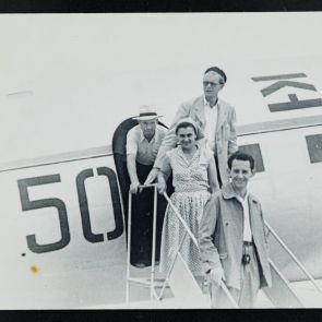 Street photographs: Group portrait of people getting off the plane