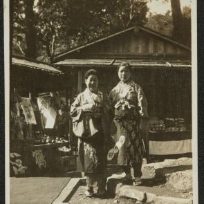 Two ladies in traditional costume in front of souvenir vendors, Jingoji, Kyoto