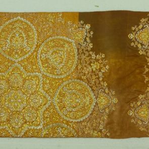 Japanese obi design sample with golden large abstract flower pattern (daikamon) in front of golden brown background