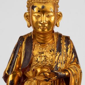Standing Buddha with the right hand in the gesture of conferring grace