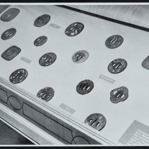 Vitrin with tsubas, exhibition interior photo - black and white photo