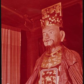 Color photo of a sculpture in a textile cloak