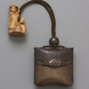 Three-case inrō with embossed flower motif, ojime on cord, and ivory netsuke depicting two figures