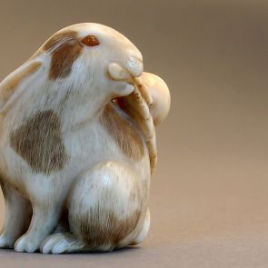 Netsuke - Rabbit holding a mespilus branch