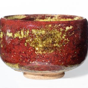 Teabowl (chawan) decorated with light green spots over a red and brown base