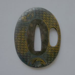 Oval sword guard (tsuba) decorated with shippō trellis pattern and flowers in circles